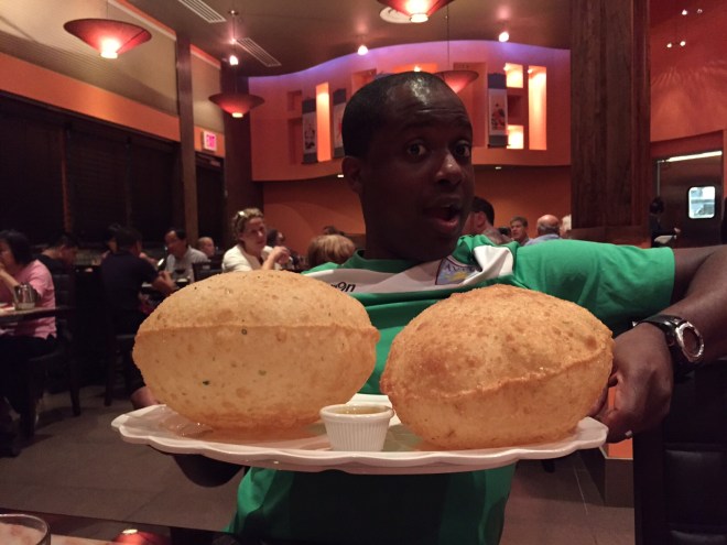 IK posing with Peter Chang's scallion pancakes.